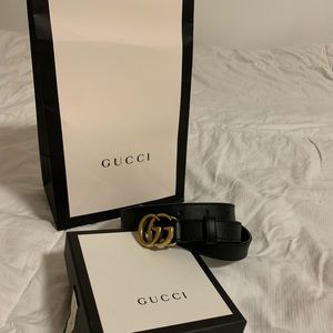 Gucci leather belt with double G buckle.